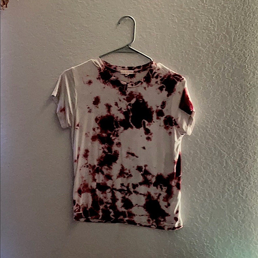 A pink and white tie die shirt
